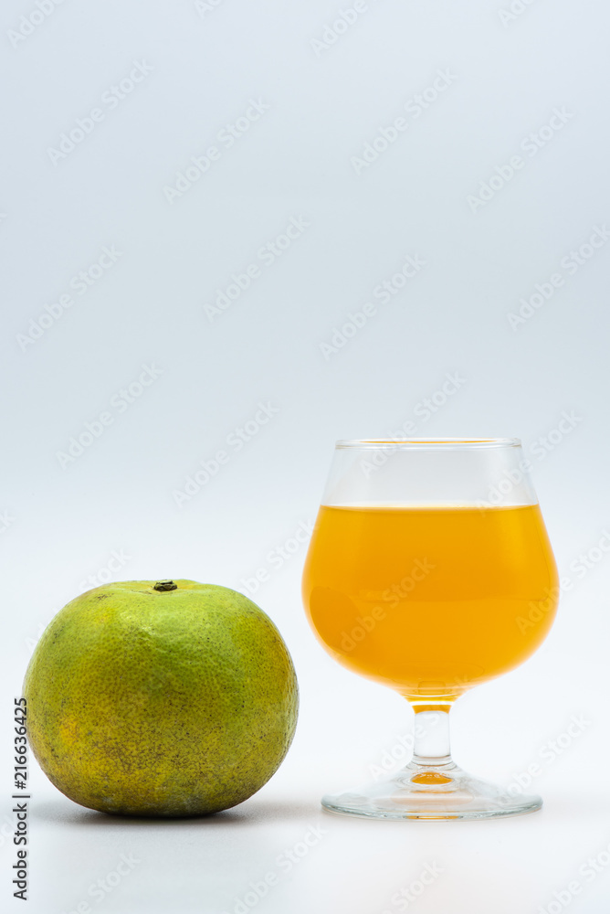 Orange juice in glass and organic orange