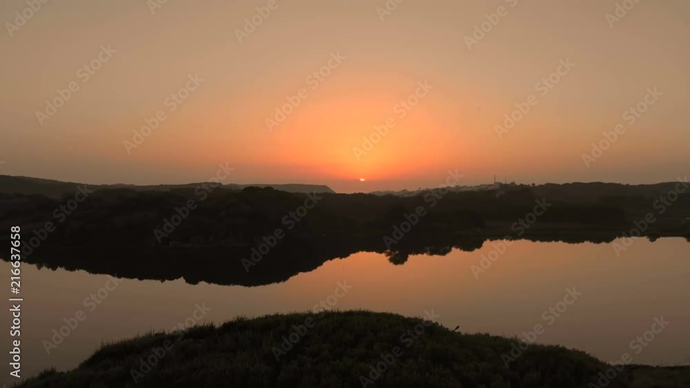 Aerial Drone View of a Lake and Hills at Sunrise in Menorca Aerial Drone View of a Lake and Hills at Sunrise in Menorca