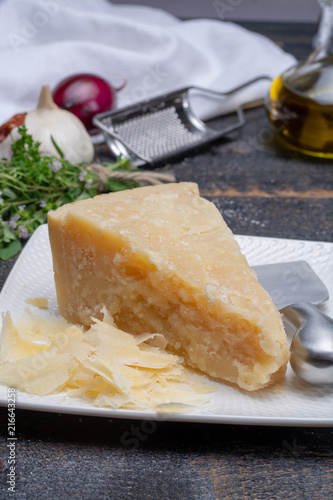 Traditional italian food - 36 months aged in caves Italian parmesan hard cheese from Parmigiano-Reggiano, Italy