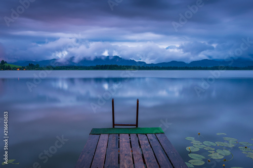 See mit Steg am Abend im Sommer - Hopfensee im Allgäu photo