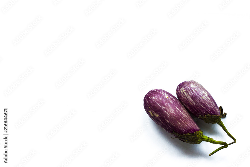 Eggplant isolated on a white background, empty space for text or for recipies. Aubergine is rich in fiber and low in calories Eggplant isolated on a white background, empty space for text or for recipies. Aubergine is rich in fiber and low in calories