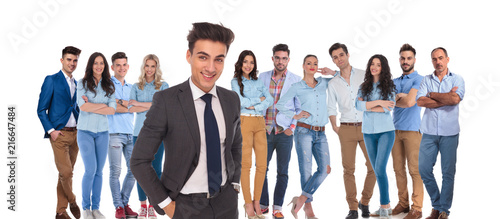 young casual team with relaxed businessman leader standing in front