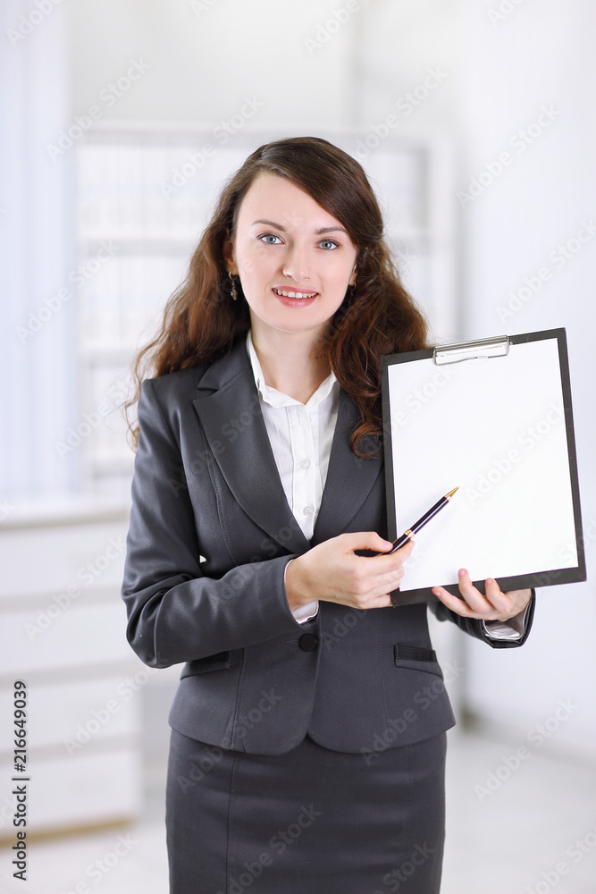 modern business woman pointing at blank sheet. modern business woman pointing at blank sheet.