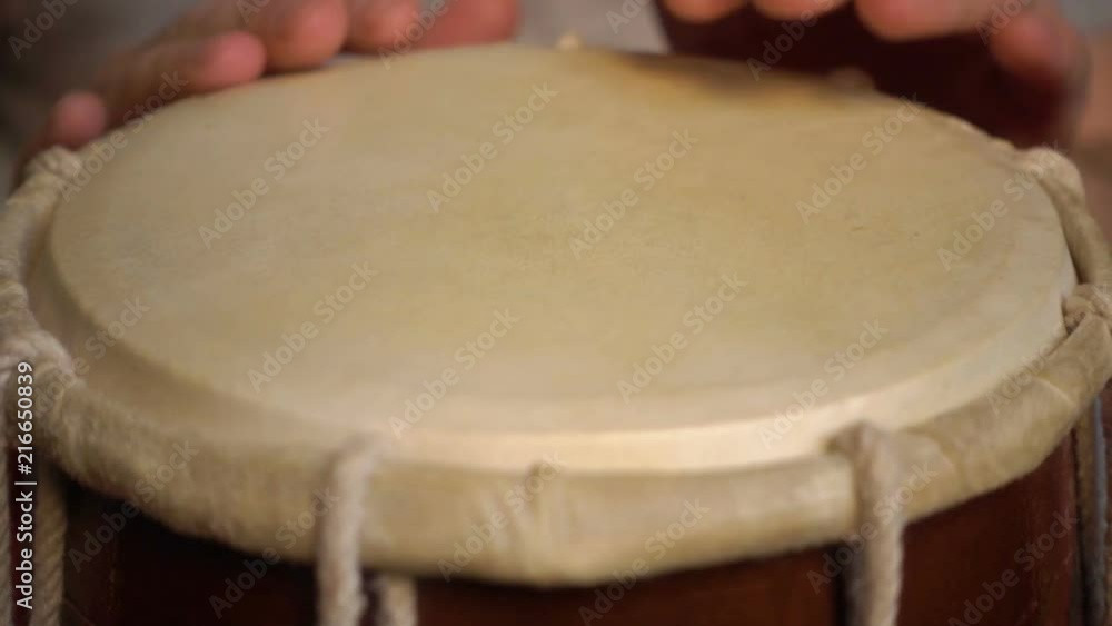 Close up of hands of a man playing a drum. Slow Motion. Close up of hands of a man playing a drum. Slow Motion.