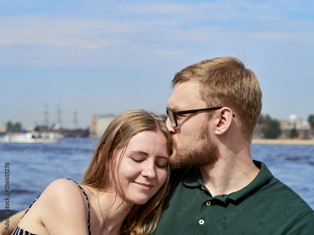 A young couple is traveling on a speedboat. A young couple is traveling on a speedboat.