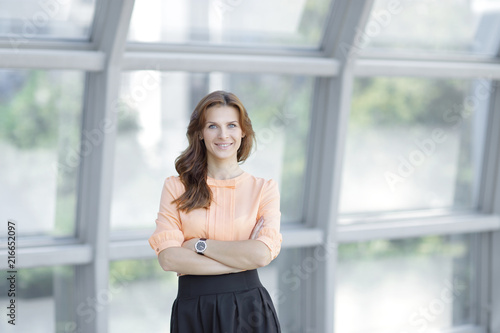 Free Download close up.portrait of modern young woman on blurred office background. - GFXLoad