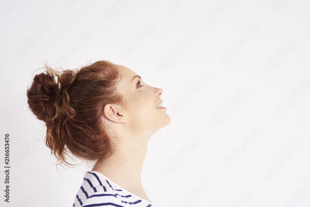 Fototapeta premium Side view of woman's face at studio shot