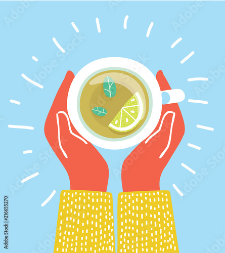 Cup of tea in hands. Brewed herbal tea with lemon.