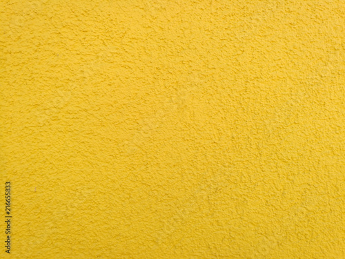 yellow background, wall with roughcast