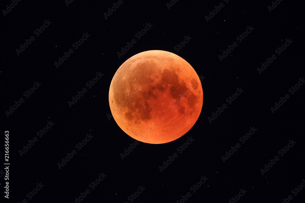 Super Bloody Moon, full eclipse phase against starry sky background Super Bloody Moon, full eclipse phase against starry sky background