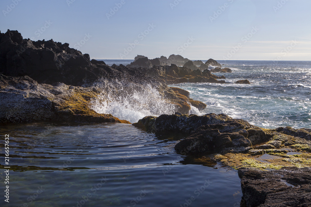 Rock pool at the coast in Mosteiros, Sao Miguel Island, Azores, Portugal Rock pool at the coast in Mosteiros, Sao Miguel Island, Azores, Portugal