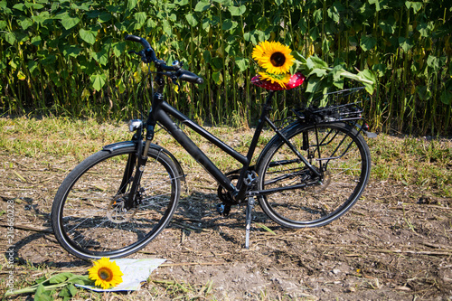 Bicycle tour, map is in front of front wheel, bike ride photo