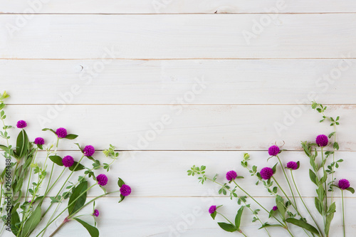 wild beautiful flowers on white wooden background © Cyrena111