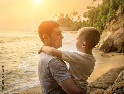 Happiness Father and son stay on the sea coastline. Tropical beach