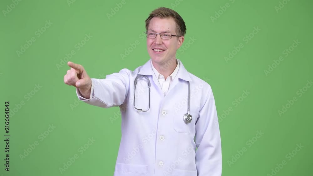 Portrait Of Young Man Doctor Pointing Finger Portrait Of Young Man Doctor Pointing Finger