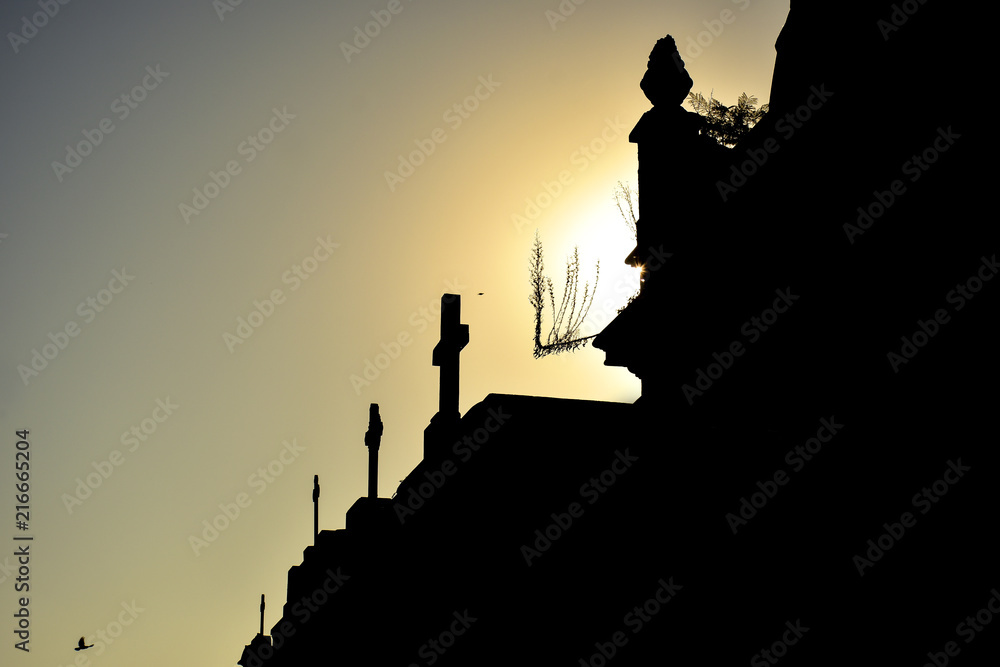 Silhouettes of the top of the tombs in the cemetery