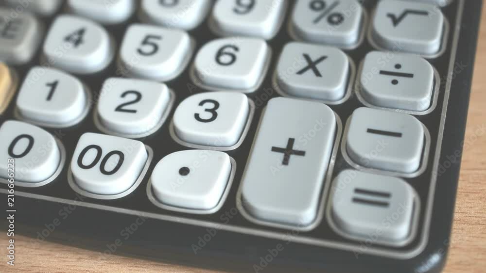 Hand operates old retro calculator.Businessman Counting On a Old Calculator close up Hand operates old retro calculator.Businessman Counting On a Old Calculator close up