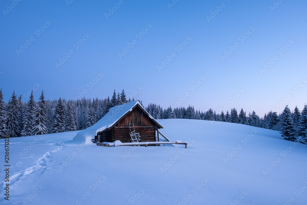 Winter landscape of a mountain forest with a cabin at sunset. Trail stamped  in the snow towards the cabin. Fir-trees and a cabin covered with snow.  Stock Photo | Adobe Stock