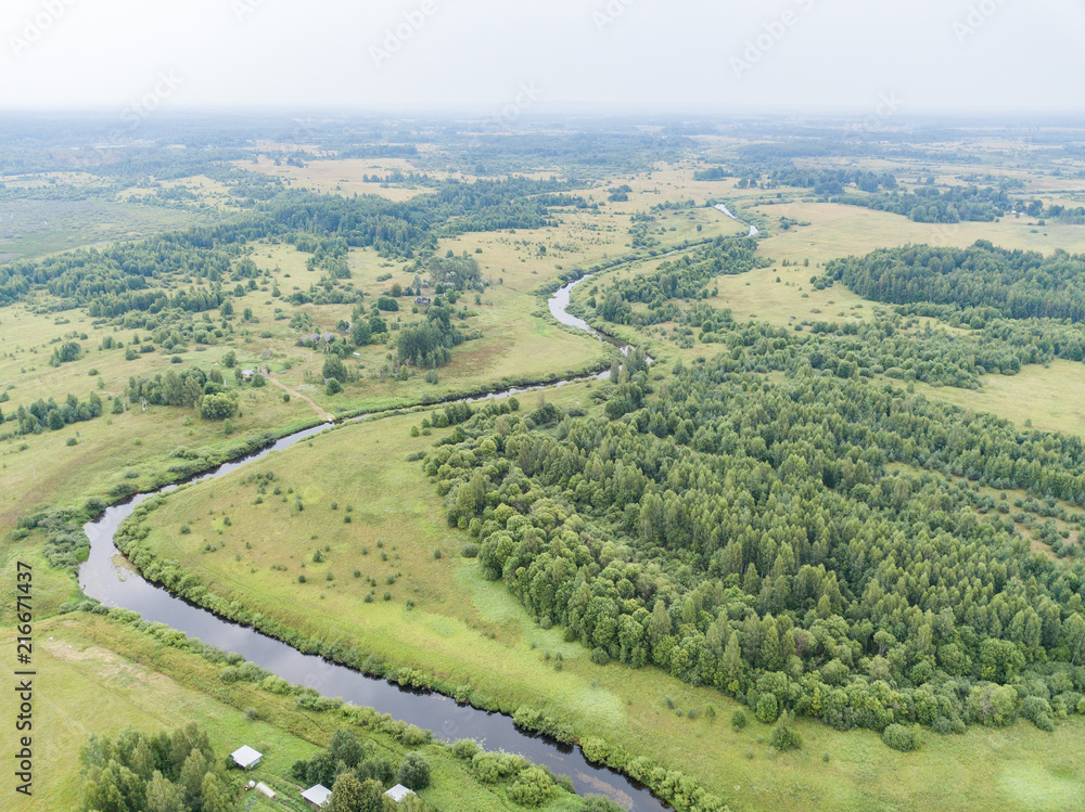 aerial view of the countryside, fields and forest 