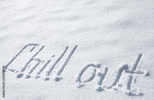 Chill out. Hand drawn text on snow