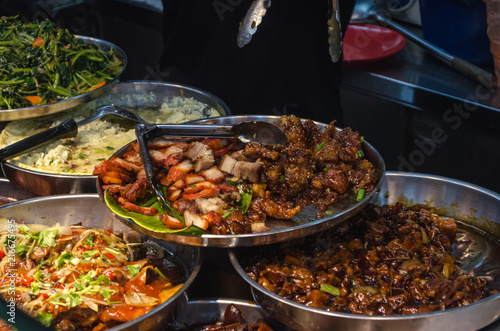 Street food of Singapore. Pork dish. Diverse dishes of street food in Singapore