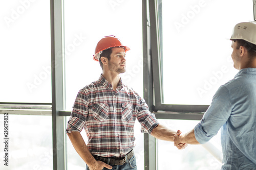 close partnership between two building companies. benefitial cooperation. panorama window on background of the photo photo