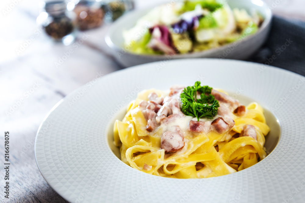 tasty Carbonara pasta on the table tasty Carbonara pasta on the table