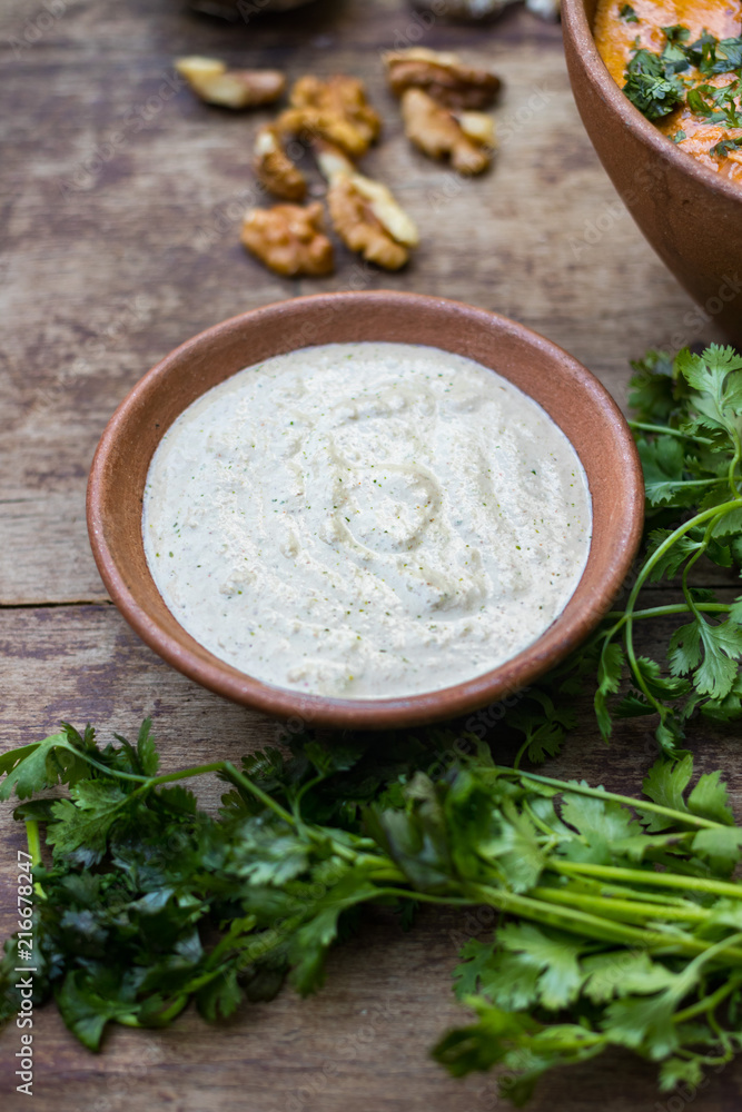 Satsivi paste sauce. Georgian traditional food cuisine made from walnuts. Used in traditional recipes as part of poultry, fish and vegetable appetizers. Vegan vegetarian healthy food Satsivi paste sauce. Georgian traditional food cuisine made from walnuts. Used in traditional recipes as part of poultry, fish and vegetable appetizers. Vegan vegetarian healthy food