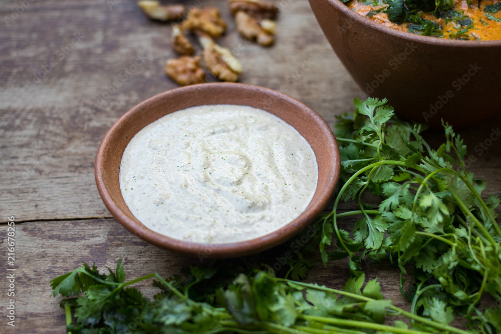 Satsivi paste sauce. Georgian traditional food cuisine made from walnuts. Used in traditional recipes as part of poultry, fish and vegetable appetizers. Vegan vegetarian healthy food Satsivi paste sauce. Georgian traditional food cuisine made from walnuts. Used in traditional recipes as part of poultry, fish and vegetable appetizers. Vegan vegetarian healthy food