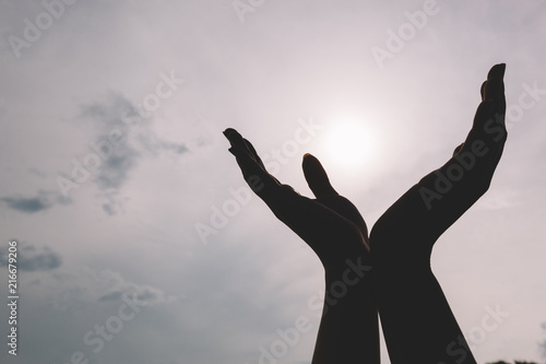 Raised hands reaching to the sky. © Photocreo Bednarek