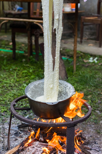 Elarji - from Samegrelo region, made from coarse cornmeal, cornflour and Suluguni cheese. Gomi cooked with cheese. Georgian traditional food - elardji.  photo