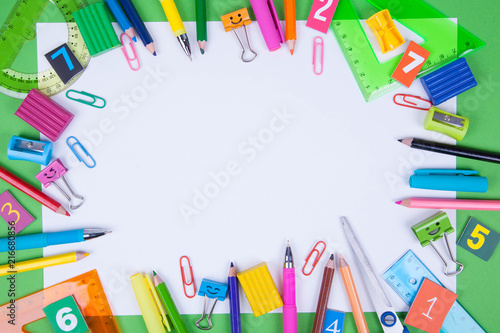 Flat lay of office and school stationery supplies. Set of colorful pens, sticky notes, notepads, pens, binderclips. top view. Back to school