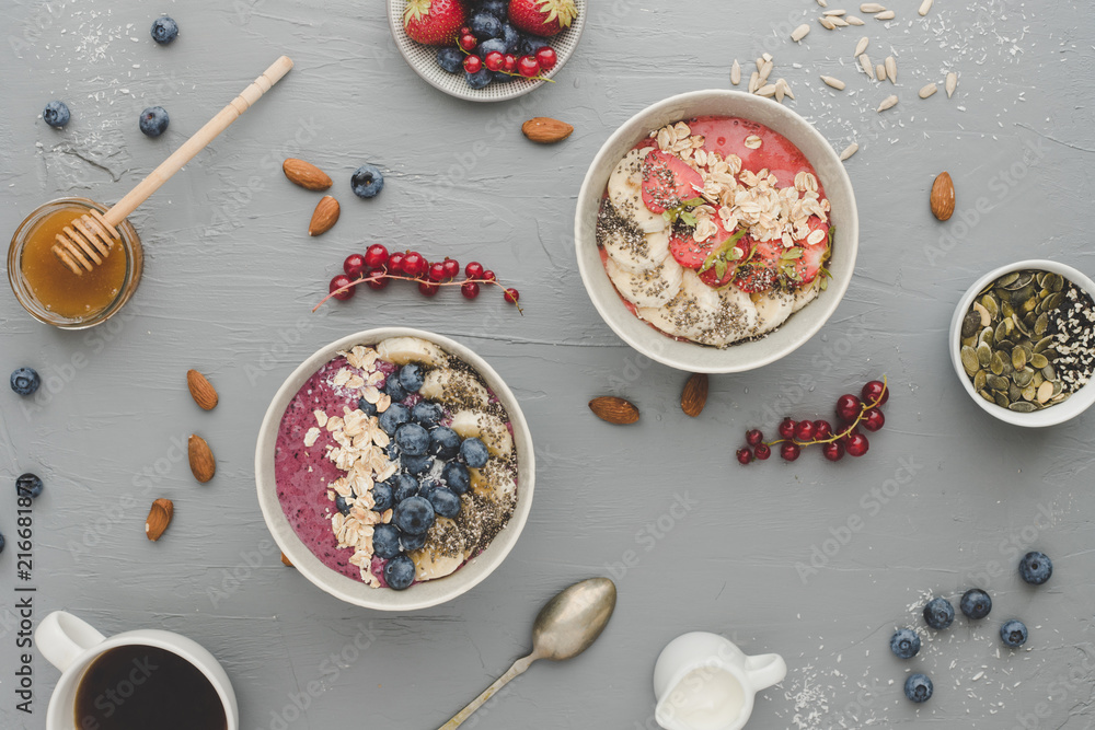 Helthy breakfast. Delicious smoothie bowls with fruits, berries and seeds.