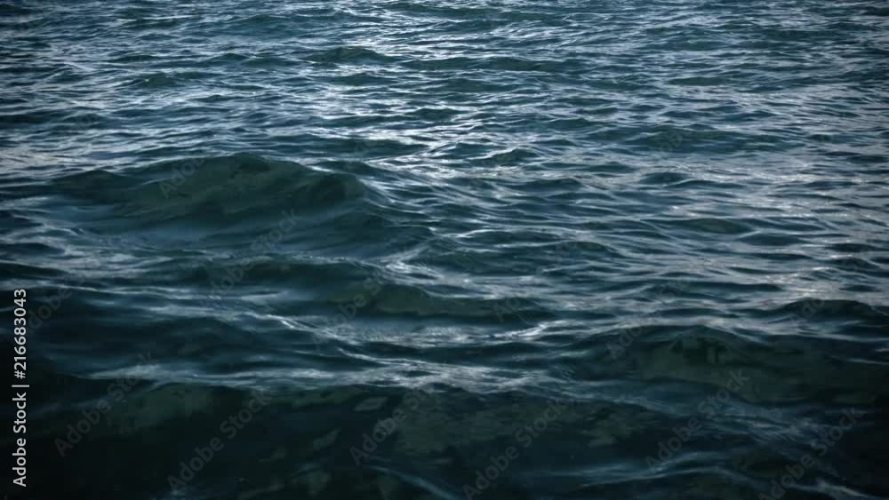 Slow motion fly over disturbed ocean water surface, Slow motion fly over disturbed ocean water surface,