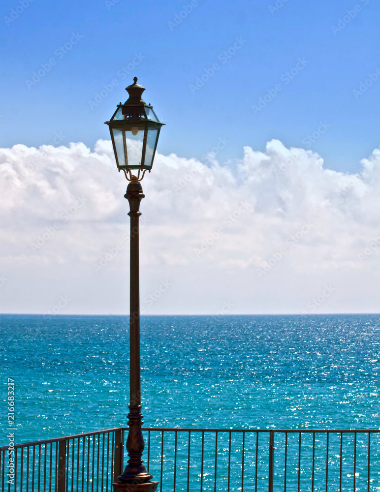 Ligurian sea, vivid blue waters from a coastal promenade in a bright day of summer