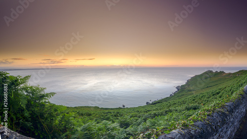 Summer sunrise on a clear day on the Start Point peninsula and light house on the south Devon coast, UK