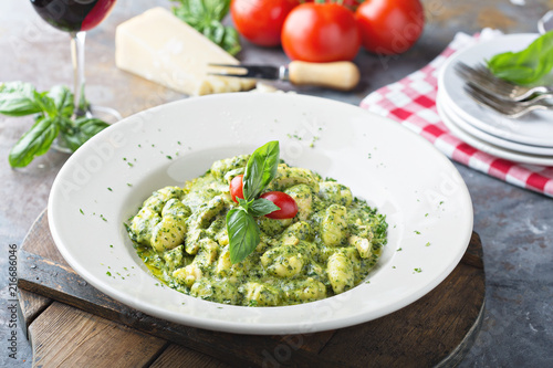 Freshly made gnocchi with pesto sauce