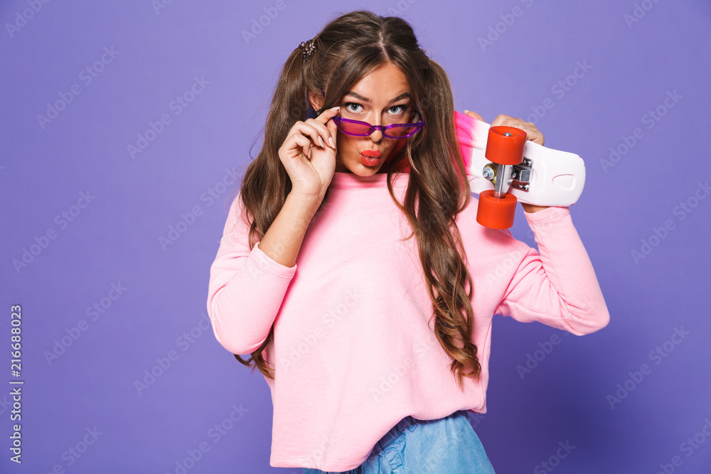 Obraz premium Portrait of a positive girl in sweatshirt