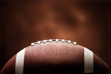 American football ball on background