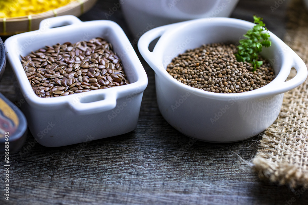 healthy food concept : flex seed and perilla seed in cute tiny cup for vegan lover concept healthy food concept : flex seed and perilla seed in cute tiny cup for vegan lover concept
