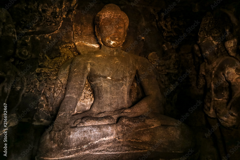 Stone statue inside rock carved Buddhist temple, Ellora Caves