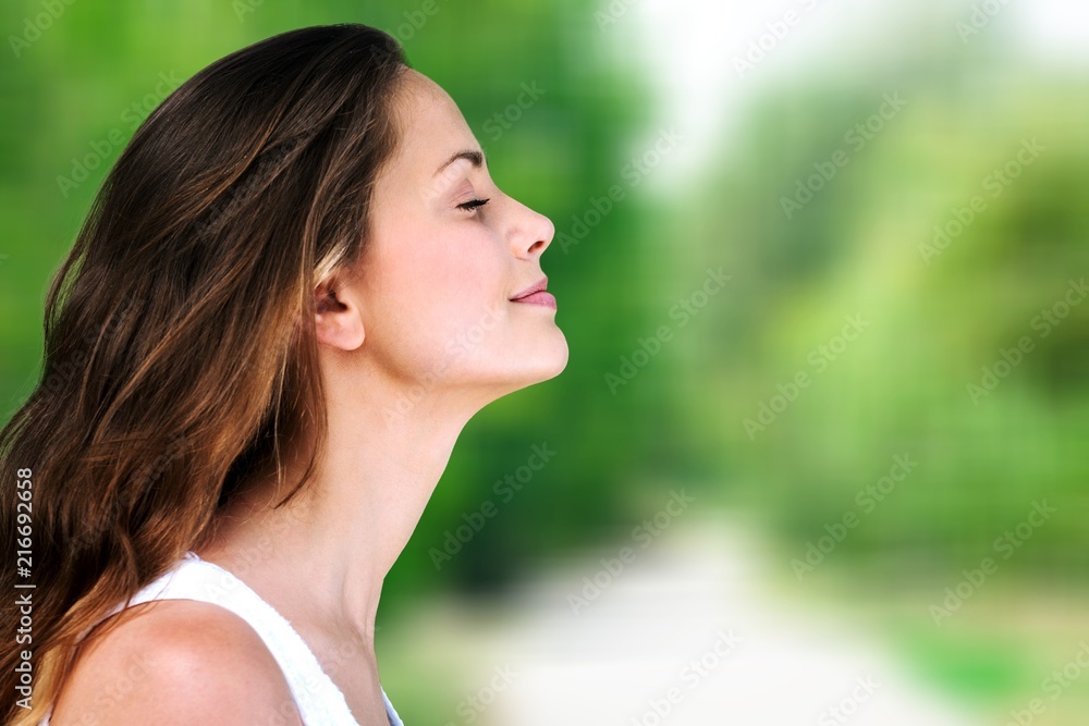 Young beautiful woman breathing outdoor Young beautiful woman breathing outdoor