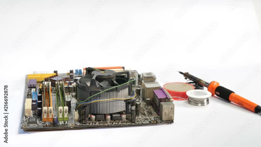 using air compressor cleaning the computer mainboard on white background using air compressor cleaning the computer mainboard on white background