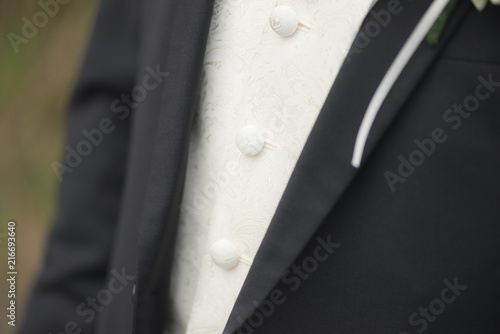 Details suit of groom at wedding
