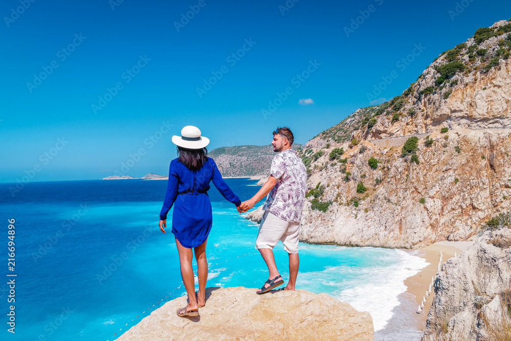 Obraz premium happy young couple man and woman on vacation at Kaputas beach Kas Turkey