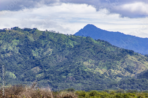 The countryside landscapes at rural areas of Honduras, jungle, hills, meadows a green and cloudy scene. Choluteca, Honduras photo