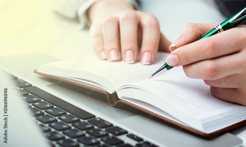 Woman with Laptop and Paperwork on background Woman with Laptop and Paperwork on background