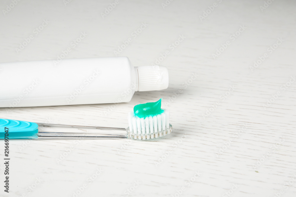 Manual toothbrush and paste on table. Dental care Manual toothbrush and paste on table. Dental care