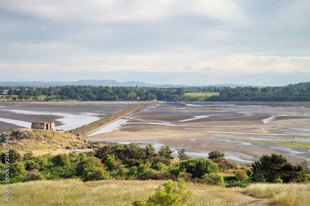 A photograph taken from Cramond Island of Cramond Beach at low tide and its surrounding nature close to Edinburgh, Scotland, United Kingdom. A photograph taken from Cramond Island of Cramond Beach at low tide and its surrounding nature close to Edinburgh, Scotland, United Kingdom.