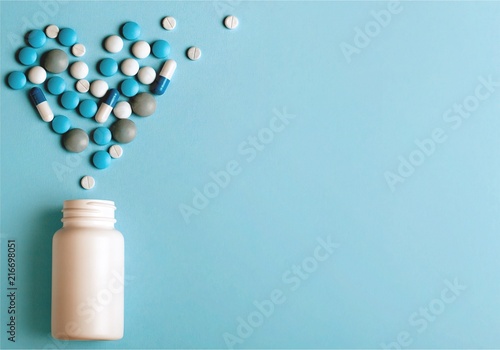 Medication pills bottle on background